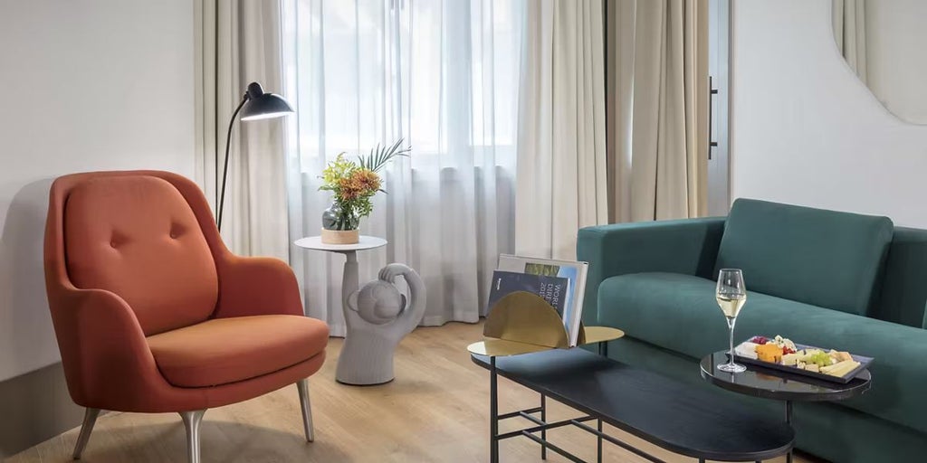 Luxurious two-bedroom suite at Barceló Torre de Madrid, featuring modern Spanish design, panoramic city views, and elegant contemporary furnishings.