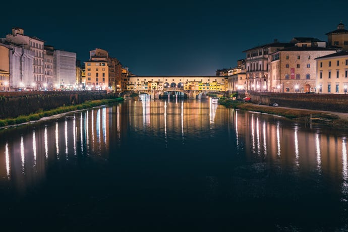 River Arno and the Ponte Vecchio bridge at night
