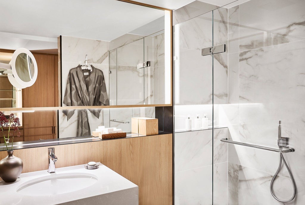 Luxurious junior suite at Nobu Hotel with contemporary design, elegant king bed, modern furnishings, and soft neutral color palette in London's Portman Square