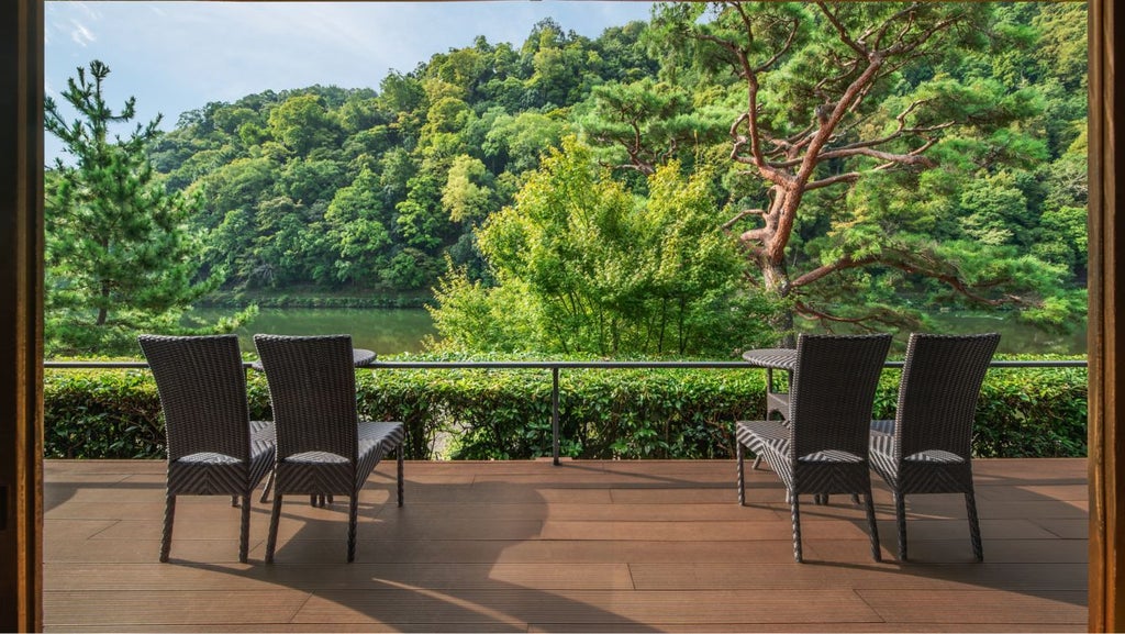 Elegant traditional Japanese ryokan-style luxury hotel nestled by a tranquil river in Kyoto, with wooden architecture and serene landscape design