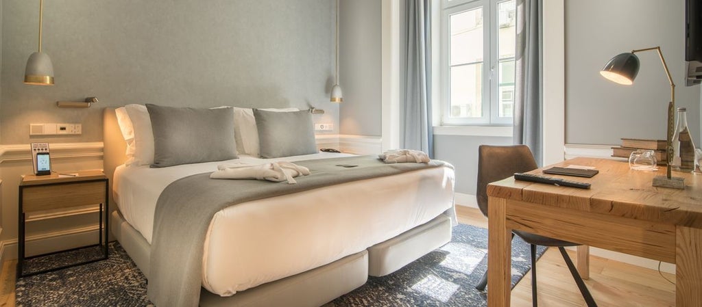 Elegant Portuguese hotel room with classic cream walls, wooden floors, and large windows overlooking charming urban scenset cityscape in soft daylight