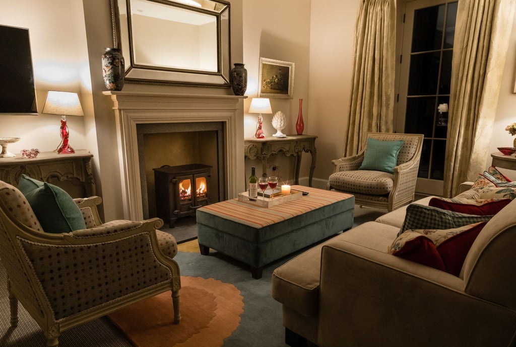 Elegant divine suite with plush white bedding, modern minimalist decor, and soft ambient lighting in a luxurious United Kingdom boutique hotel room