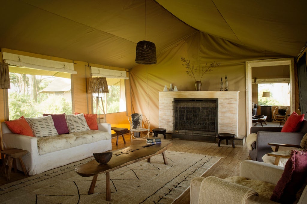 Solar-powered luxury tented camp perched on Ngorongoro Crater rim with canvas walls, wooden deck, and panoramic savanna views