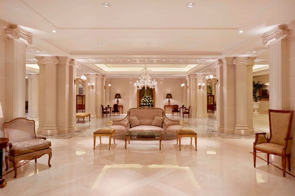 Elegant white Hotel scenic facades in Athens with wrought iron balconies and classical Greek architecture overlooking the Acropolis