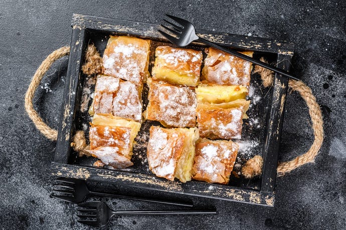 Bougatsa are breakfast pastries filled with feta or custard. Source: Mironov Vladimir / Shutterstock