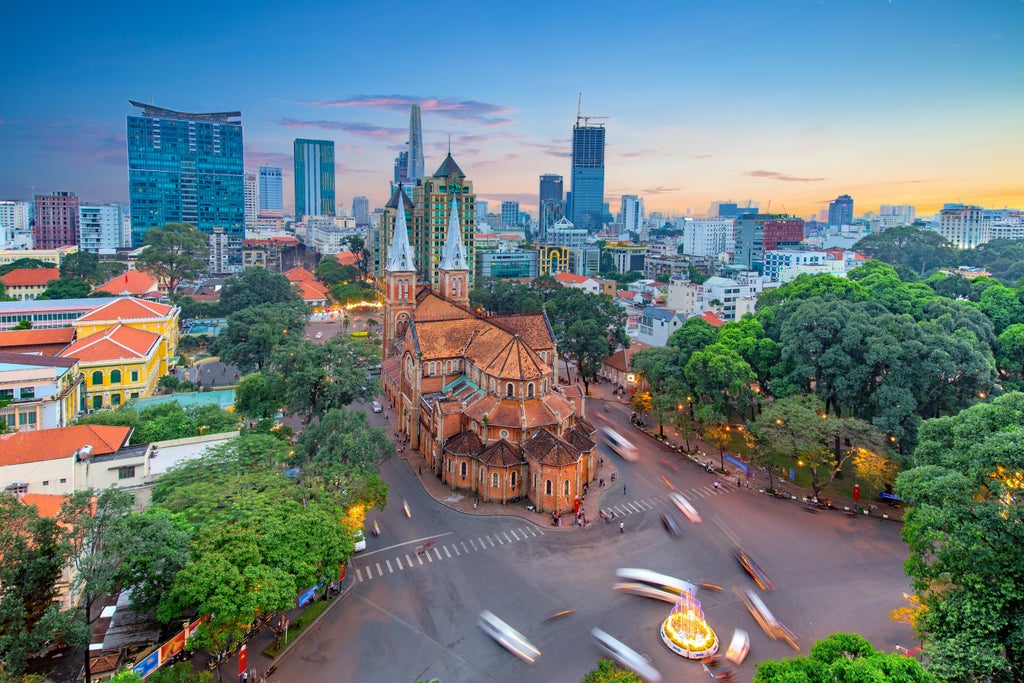 Luxurious guided tour exploring Saigon's vibrant streets, iconic landmarks like Notre-Dame Cathedral, bustling markets, and historic colonial architecture in Vietnam