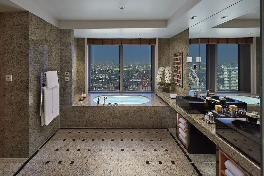 Elegant Oriental Suite featuring panoramic Tokyo views, sleek modern furnishings, marble bathroom, and traditional Japanese design elements