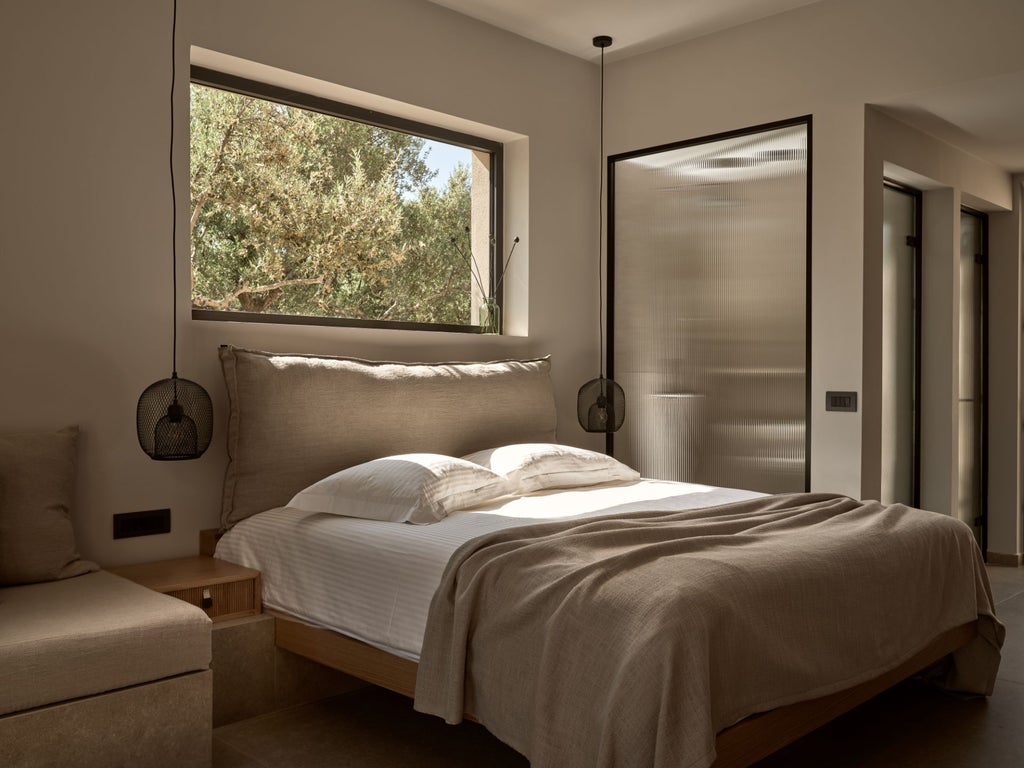 Elegant white-washed Greek villa bedroom with panoramic sea view, minimalist design, and crisp linens overlooking azure Aegean coastline at sunset