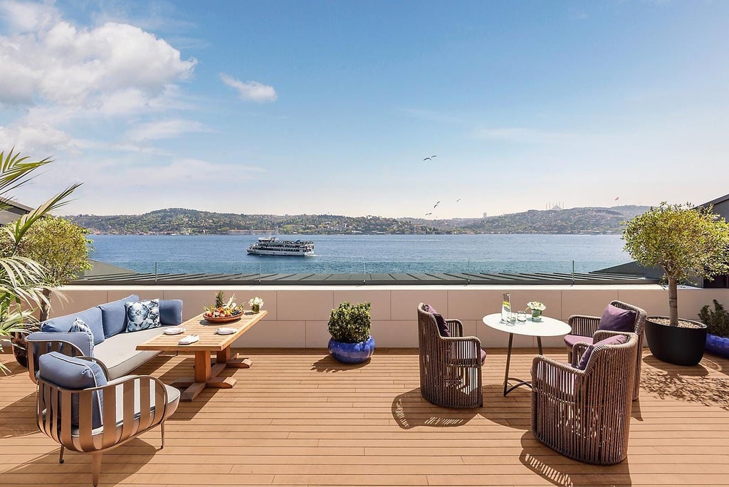 Spacious, elegant two-bedroom presidential suite overlooking Bosphorus, featuring modern Turkish design, panoramic water views, and luxurious contemporary furnishings