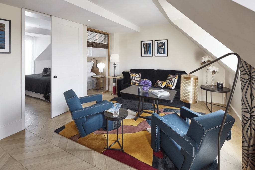 Elegant Parisian hotel suite with plush king bed, soft neutral tones, modern design, large windows overlooking a chic urban streetscape in the heart of France