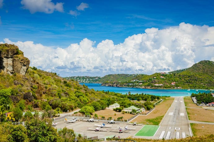 Rather than a nuisance, the occasional plane landing adds to the excitement at St Jean beach