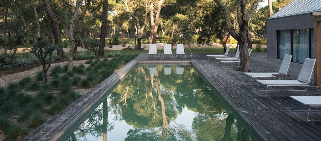 Luxurious bio-pool suite at Sublime Comporta Hotel, featuring minimalist design, natural tones, and seamless indoor-outdoor living in Portuguese coastal landscape