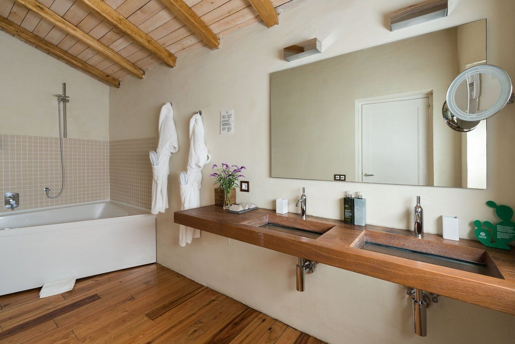 Luxurious Sicilian villa bedroom with rustic stone walls, elegant furnishings, and panoramic window overlooking lush Mediterranean landscape