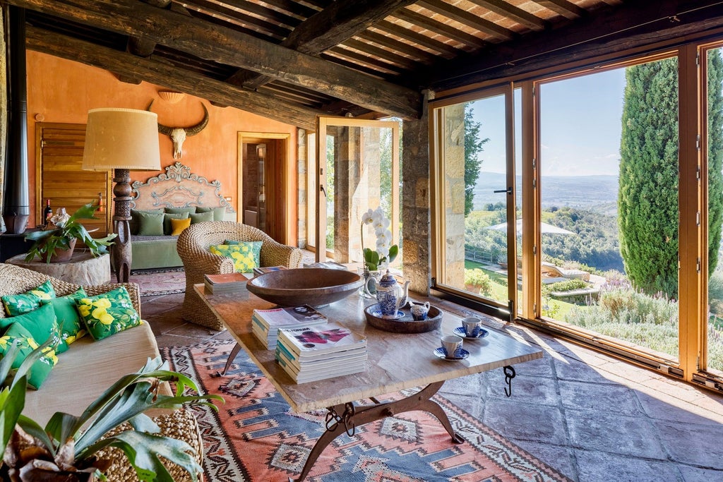 Elegant rustic Italian villa bedroom with antique wooden furnishings, soft linen, stone walls, and panoramic Tuscan countryside view through large windows