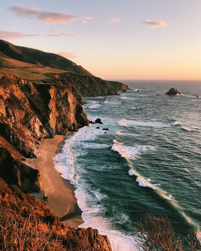 Luxurious glamping tent nestled in Big Sur forest with private deck, outdoor furniture and forest views at Ventana resort