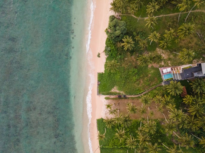 Long stretches of pristine beach and clear water in Ahangama