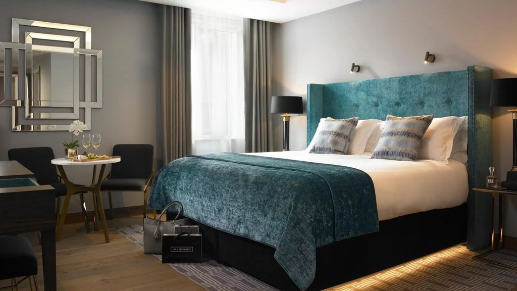 Luxurious premium king hotel room with elegant contemporary design, soft neutral tones, plush bedding, and sleek modern furnishings at a premium Irish hotel