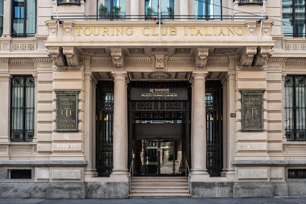 Elegant Art Nouveau facade of Radisson Collection hotel in Milan with ornate stonework, grand entrance and classical Italian architecture