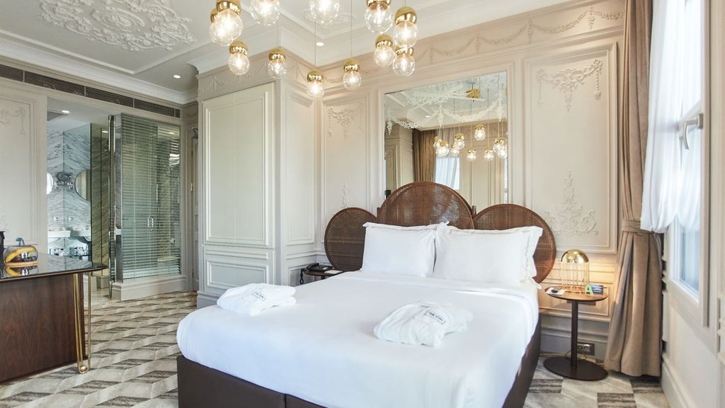 Luxurious Ottoman-style family suite with panoramic Bosphorus views, elegant dark wood furnishings, and traditional Turkish architectural details