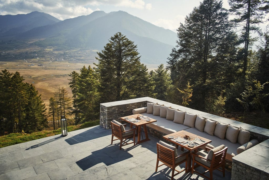 Luxurious wooden lodge with panoramic valley views in Bhutan, featuring floor-to-ceiling windows and traditional architectural elements