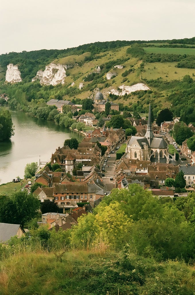 Scenic view of Normandy's historic D-Day landing beaches, memorial monuments, and lush coastal landscape showcasing World War II remembrance and natural beauty.