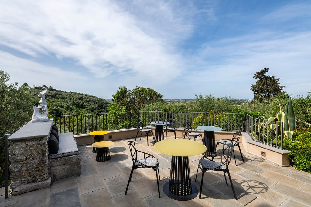 Chic Tuscan boutique hotel with rustic elegance, white-washed walls, wooden furniture, and panoramic countryside views near [Location] landscape