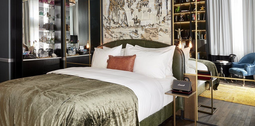 Elegant contemporary hotel suite with minimalist design, featuring plush king bed, soft neutral tones, and modern urban sophistication in Germany's Sir Savigny hotel