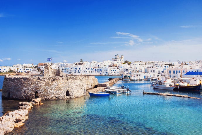 Navigate the charming whitewashed towns such as a town on Paros
