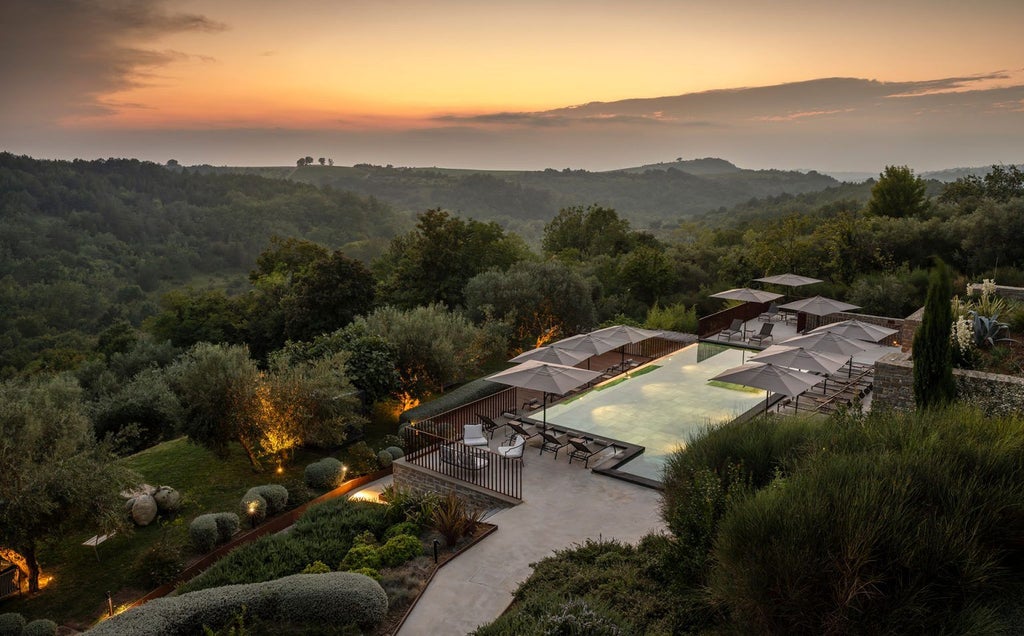 Elegant Mediterranean hotel exterior with stone facade, arched windows and balconies overlooking pristine Adriatic coastline at dusk