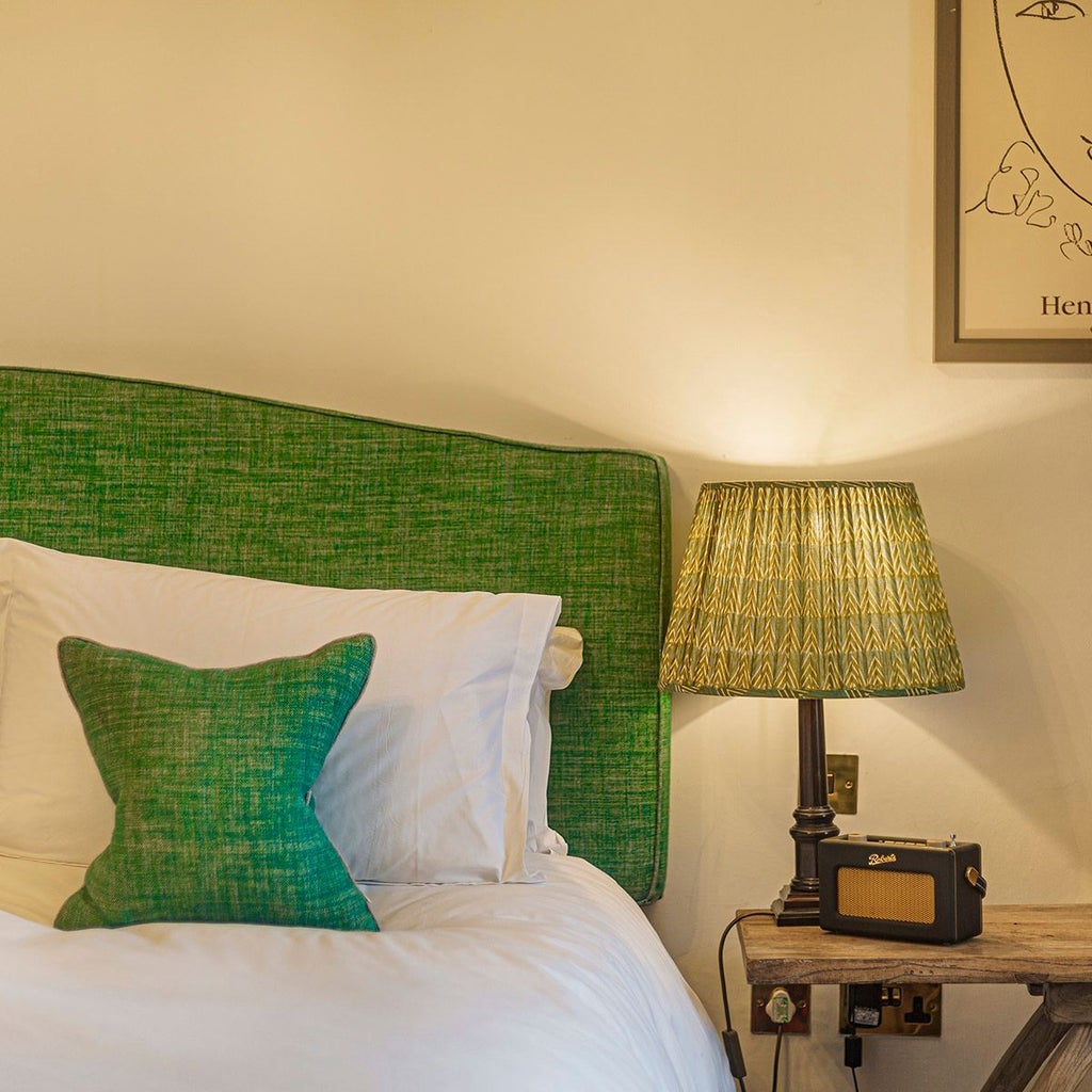 Elegant superior double room at The Talbot Malton, featuring plush white bedding, classic wooden furnishings, and soft neutral color palette in a refined UK setting