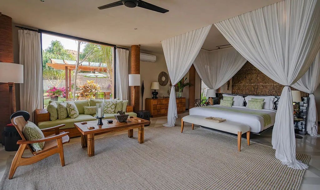 Luxurious open-air Putri Wamoro Jungle Villa at NIHI Sumba, featuring traditional Indonesian design with panoramic tropical forest views and elegant outdoor living space.