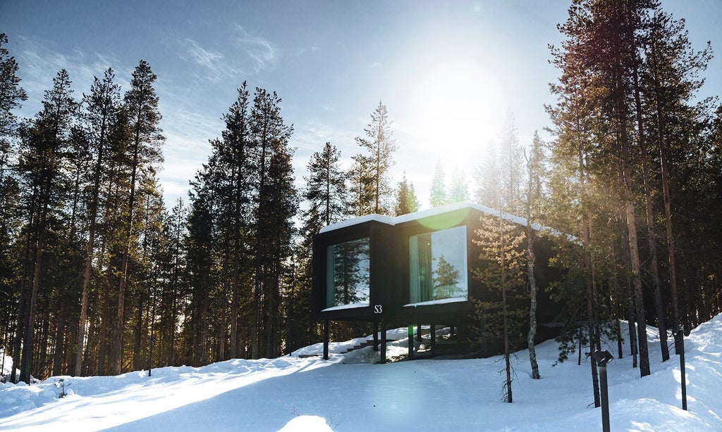 Luxurious executive suite with floor-to-ceiling windows overlooking snowy Nordic forest, contemporary Scandinavian design with warm wood tones and minimalist decor