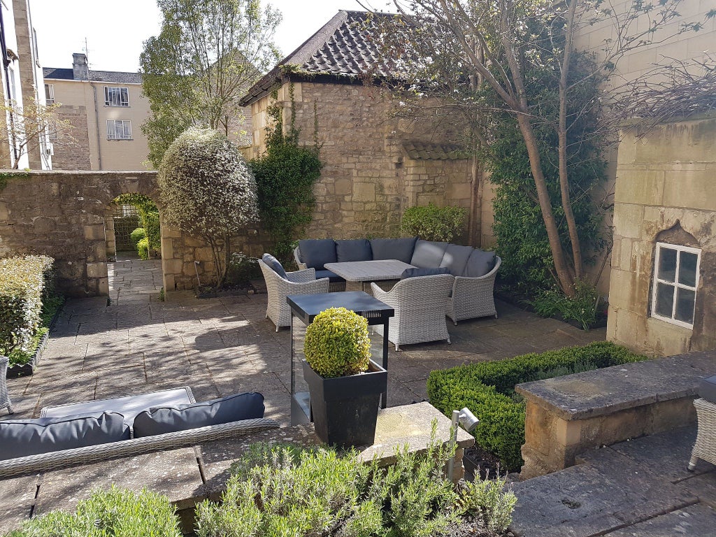 Elegant Georgian townhouse hotel with classic architecture, soft lighting, and luxurious cream-colored facade in central scenset, United Kingdom