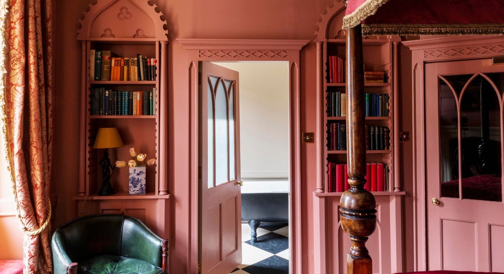 Elegant Superior Double room at Hazlitt's boutique hotel, featuring plush bedding, classic British decor, and warm wooden furnishings in a sophisticated setting