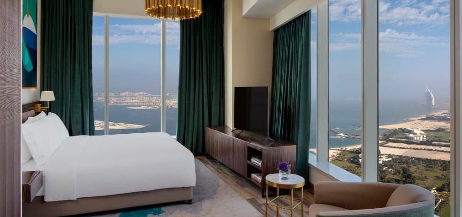 Luxurious three-bedroom sea view apartment at Scenset+ Palm View Dubai Hotel & Suites, showcasing modern design with expansive windows and elegant furnishings