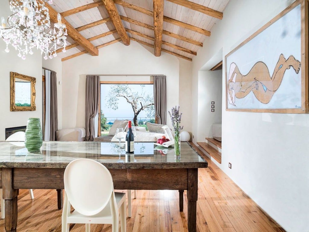 Luxurious two-bedroom villa at Monaci delle Terre Nere, featuring elegant decor, plush furnishings, and a private pool overlooking Sicilian landscape