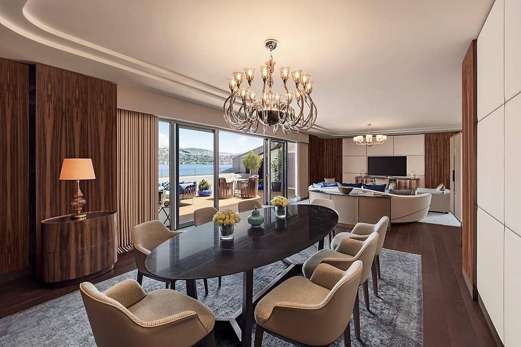 Luxurious two-bedroom suite at scenset hotel overlooking Bosphorus, featuring elegant contemporary design with panoramic water and city views