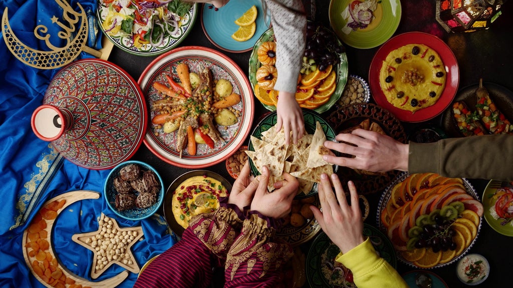 Vibrant Moroccan spices, traditional copper cookware, and local artisan preparing intricate tagine in a sun-drenched Fez marketplace stall