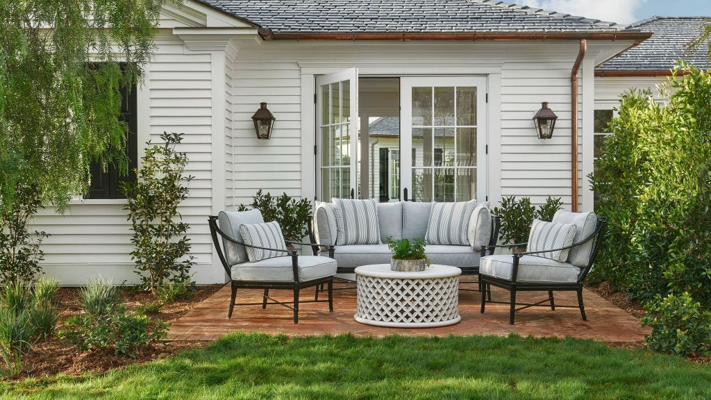 Luxurious coastal garden bungalow suite with pristine white interiors, plush bedding, and elegant coastal California design at scenic beachfront resort