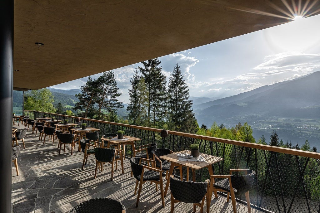 Luxurious contemporary hotel nestled in scenic Italian landscape, featuring minimalist design, floor-to-ceiling windows, and stunning mountain panorama at dusk