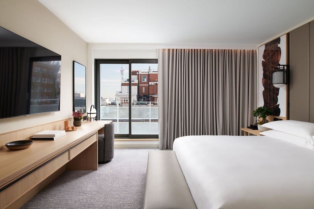 Elegant superior room at luxury Nobu Hotel in London, featuring modern minimalist design with plush bed, soft neutral tones, and contemporary urban sophistication