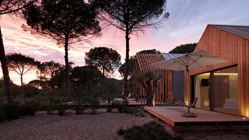 Minimalist bio-pool suite at Sublime Comporta Hotel with sleek white design, expansive windows, and serene natural landscape of coastal Portugal