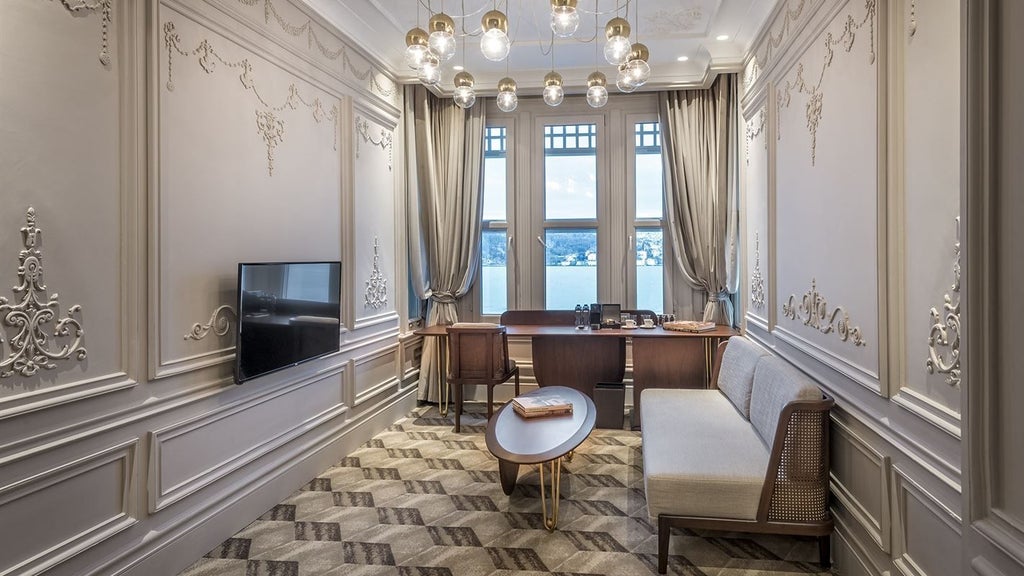 Luxurious executive suite with panoramic Bosphorus views, featuring elegant contemporary design, plush king bed, and floor-to-ceiling windows overlooking Istanbul's waterfront.