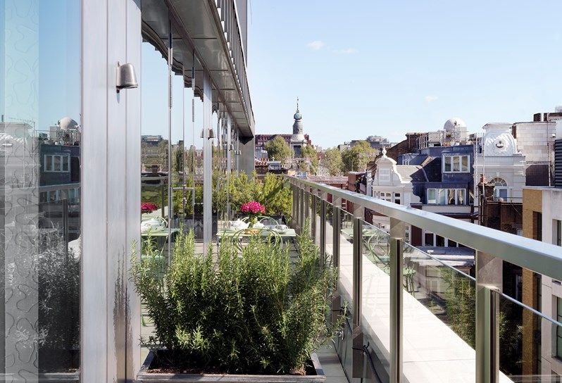 Luxurious two-bedroom terrace suite at Ham Yard Hotel, featuring elegant design, modern furnishings, and a spacious private outdoor terrace with contemporary styling.