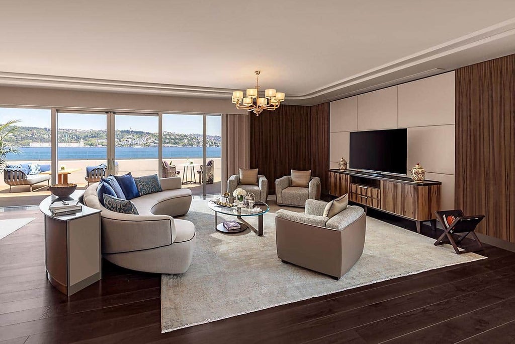 Luxurious two-bedroom suite at Mandarin Oriental overlooking Bosphorus, featuring elegant decor, expansive windows, and stunning water views in Istanbul