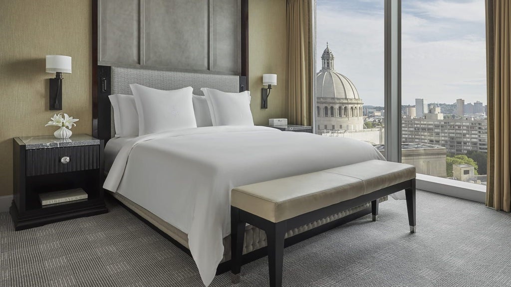 Spacious Four Seasons Executive Suite with panoramic city views, elegant contemporary design, plush king bed, and sophisticated urban luxury in downtown scenset.