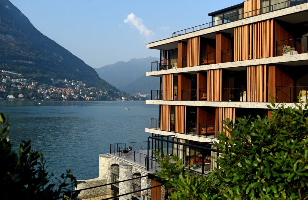 Luxurious modernist hotel Il Sereno perched on Lake Como's edge, featuring sleek architecture and infinity pool overlooking the water