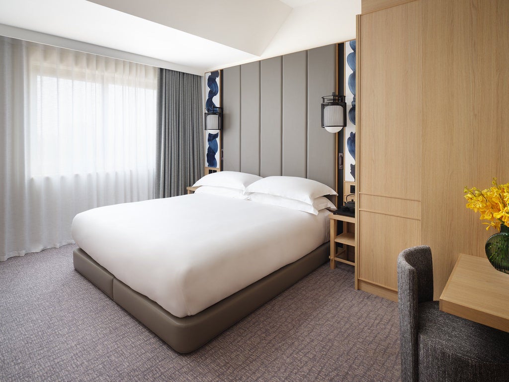 Luxurious Superior Room at [Hotel] with contemporary design, featuring plush king bed, elegant neutral tones, and modern minimalist furnishings in London's Portman Square