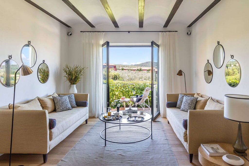 Elegant Italian boutique hotel suite with soft neutral tones, plush white linens, rustic wooden furniture, and warm ambient lighting at Locanda Rossa