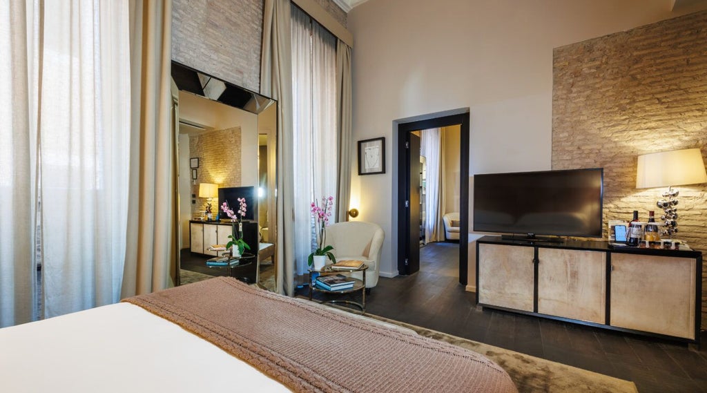 Elegant suite at D.O.M. Hotel in Italy, featuring opulent marble bathroom, plush king bed, and city view with refined contemporary design elements